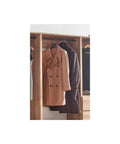 Custom Walk In Closet System With Sturdy Wooden Drawers And Flexible Shelves Modular Wardrobe Organizer Featuring Hanging Rods And Hella Roomy Shoe Storage Kick The Clutter To The Curb with coats hanging.
