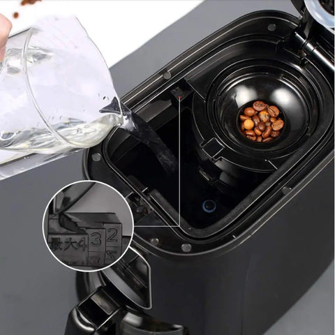 Compact Automatic Freshly Ground Coffee Brewer With Onboard Bean Grinder And Programmed Cup Settings filling with water and coffee beans visible.
