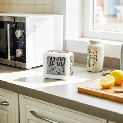 Top Notch Silent Digital Alarm Clock With Cool Starfish Shell Shape And Gentle Nightlight For Bedrooms Or Work Desks Checks Time Date Temperature Brings Easy Snooze Feature Down To Earth Vibe For Students And Crew on kitchen countertop.