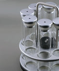 Eight Single Dose Espresso Bean Storage Tubes With Rotating Display Rack And Precision Funnel Set, clear tubes with silver lids.