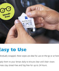 ZEISS AntiFOG Wipes, 120-count pack; hands opening a wipe near a car steering wheel