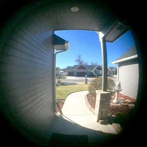 Wide-angle view through Solid Brass 220 Degree Door Viewer with Rotating Privacy Cover installed on door