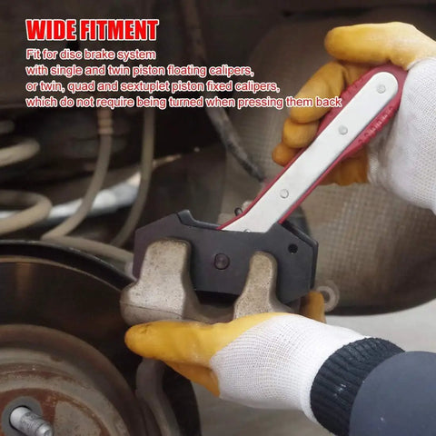 Brake Caliper Press Tool With Ratcheting Piston Spreader For Car Disc Brakes Includes Two Steel Plates And Four Caliper Hangers Pro Grade DIY Kit For Easy Pad Installation And Caliper Service in use during brake service, showing tool expanding brake caliper piston.