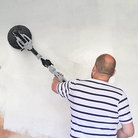 Person using Drywall Sander Kit With 710W Electric Sander, 12 Discs, 5 Speed Settings on wall for smooth finish