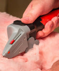Hand using All in One Drywall Tool With Built In Tape Measure And Utility Knife Measure Mark And Cut Drywall Shingles Tile Carpet Foam Insulation And Wood For Rip Cuts Like A Pro DIY Handy Home Improvement Favorite on insulation