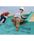 Zero Hassle Heavy Duty Synthetic Roof Underlayment Covers A Whole 10 Squares Of Your Deck Pro Level Waterproof Protector Wrinkle Free Built Like A Tank Job Site Ready And Code Approved, two workers applying underlayment on a roof.