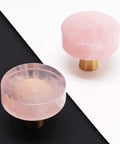 Pink Rose Quartz Cabinet Knobs 2 Pack with Brushed Brass Base on black and white background