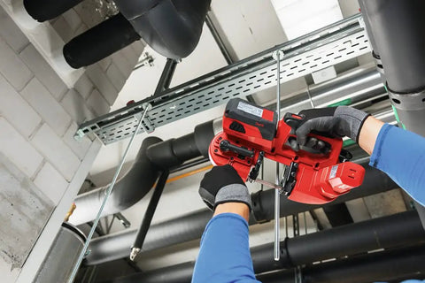 Person using Cordless Band Saw With 22V Battery And LED Light For Cutting Up To 64 mm And 2 1/2 Inch Thick Materials in a workshop
