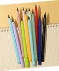 Everlasting Reusable No Sharpening Pencils Set For Students And Artists Graphite Sketch Pencils in multiple colors on notebook