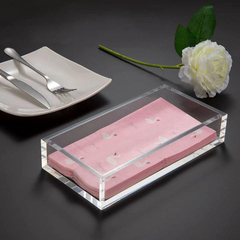 Crystal Clear Acrylic Napkin Holder Tray With 8mm Thick Build, Inner 8.3 By 4.7 By 2.2 Inches holding pink napkins on table.