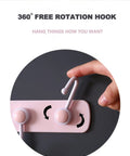 Hand adjusting hook on Kids Room Wall Mount Coat Rack With Six Rotating Adhesive Hooks for easy installation.