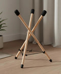 Heavy Duty Beech Wood Drum Rack With Tripod Legs And Adjustable Rope Mount For Steel Drums Folds Flat For Tour Ready Travel Hella Stable Pro Vibe With Thick Sponge Padding Large with visible tripod legs.