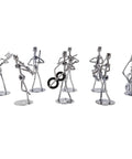Premium Hand Welded Music Note Statues Set Of Eight slick industrial wire sculptures, 5-inch tall metal musicians on stands.