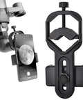 Universal Smartphone Telescope And Microscope Adapter Mount For IPhone Samsung HTC LG And Other Phones Fits 55 To 85 Mm Wide shown attached to telescope with moon visible on phone screen.