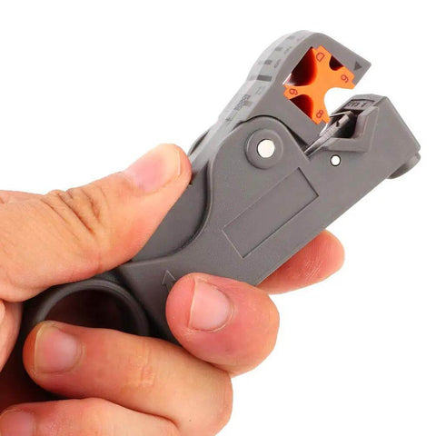 Hand holding Coaxial Cable Stripping And Crimping Tool With Adjustable Two Blade Knife, Compatible With 4 5 6 And 7 Coax Cables