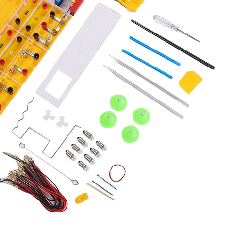 Components from Comprehensive Physics Experiment Kit With 68 Electrical And Magnetic Experiments laid out, showing tools and modules.