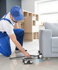 Worker using Heavy Duty Furniture Moving Dolly With Reinforced Steel Panel 360 Degree Swivel And Top Brake With Wheels Set Of 4 Lifting Tool Up To 3000 Lbs For Appliances Sofas Fridges And Washing Machines to move a sofa on tile.