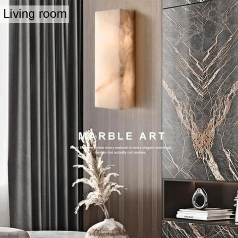 Square Marble Wall Lamp With Wood And Stone Shade in a stylish living room, warm LED glow, modern rustic decor.