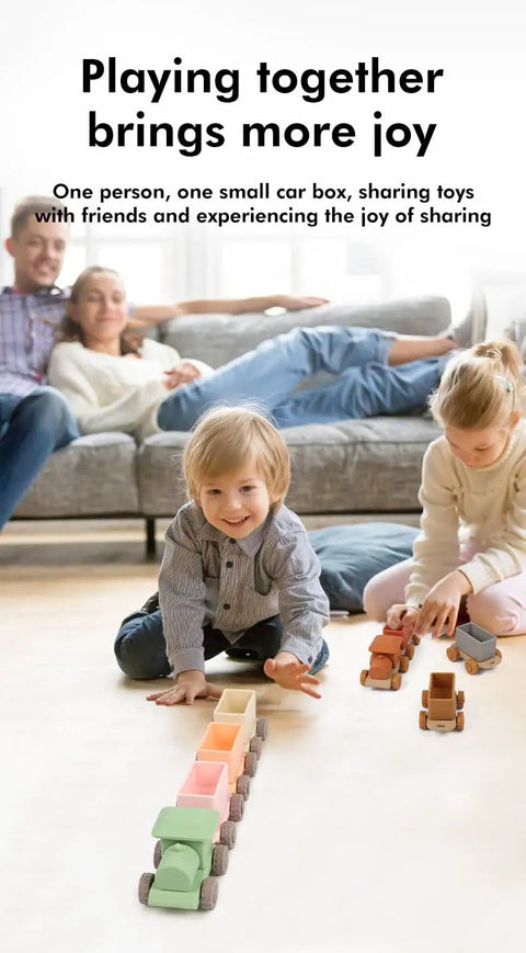 Game Changing BPA Free Silicone Toy Train For The Kiddos Push And Pull Stacking Blocks in use with children on a floor.