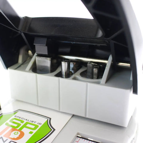Close-up of three punches in a Three In One ID Card Hole Punch Tool For Name Badges with round, slot, and corner punches.