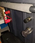 No Sweat M10 Remote Battery Terminals And 250 Amp Jump Post For Quick Terminal Relocation Easy Panel Mount With Solid Brass Core Red Black Pair For Your Ride, close up view of mounted terminals.