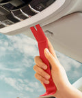 Hand using a red nylon tool from Snag These Dope 5 Piece Nylon Auto Trim Removal Tools For Your Ride for car dashboard repairs.