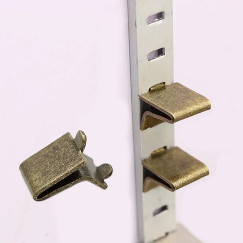 Built Tough Adjustable Steel Pilaster Shelf Clip Brackets with Dead Simple Slide Mount and Smooth Galvanized Coating for Any Standard Wood or Metal Shelving Rack System Bronze, detail view of a bracket.