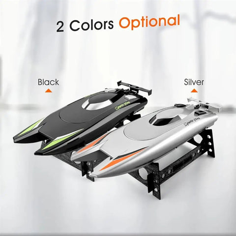 Crazy Fast RC Racing Boat For Adults With Dual Motors Two Point Four GHz Remote Control Waterproof Hull 32cm shown in black and silver on stands.