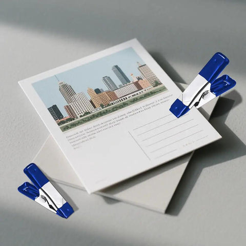 2 Inch Mini Spring Clamps Set Of 30 Heavy Duty Metal Clips clipping postcards on a surface