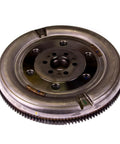 Knockout Dual Mass Clutch Flywheel For 2003-2006 Audi TT And TT Quattro Manual 1.8L Inline Four top view of metallic flywheel assembly.