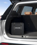 Heavy Duty Level 2 Ev Charger For Tesla With Nacs Cord And Nema 14-50 Plug At Forty Amps inside car trunk.