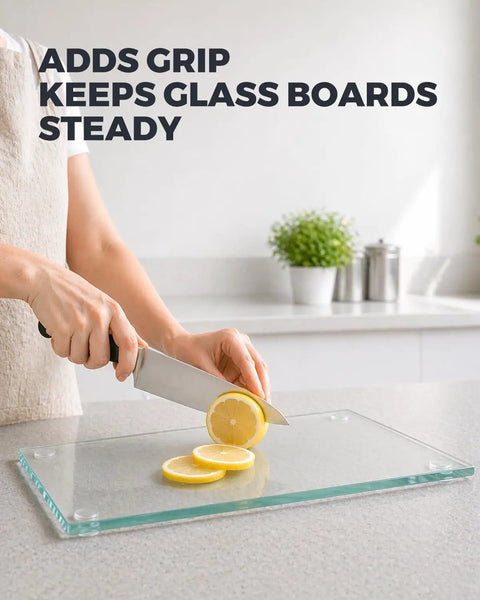 Rock Solid Clear Silicone Anti Slip Pads For Glass Tables And Desks With Zero Slide Grip and Protective Two Millimeter Cushion To Keep Furniture Locked Down In A Slick Thirty Six Pack used on a glass cutting board with sliced lemons.