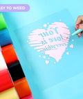 White Heat Transfer Vinyl Roll 12 Inch by 20 Feet for Shirts and Projects Easy Cut Weed HTV demo with heart design on blue