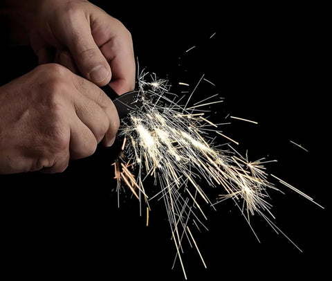 Sparks flying from Emergency Fire Starter Kit With Pre Shaved Magnesium, 3.15 Inch Ferro Rod, And 4 Inch Waxed Rope In Waterproof Tin