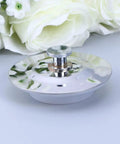 Bathtub Stopper for 40-45mm Holes Flat Cover Stainless Steel on a surface, showing its shiny flat design and drain fitting.