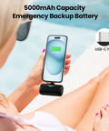 Person using Compact USB C Power Bank With Built In USB C Connector 5000mAh PD Fast Charging Battery Pack on iPhone outdoors.