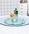 360 Degree Tempered Glass Lazy Susan Turntable With Silent Rotation on table, featuring heavy duty serving tray and anti roll over design.