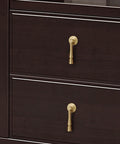 Slick Eight Piece Set Of Black Solid Brass Cabinet Knobs And Drop Style Pulls For Kitchen Drawers And Cupboards With Dang Tough Screw Mount Hardware That Brings Badass Retro Charm To Your Home showing golden drop handles on dark drawers.
