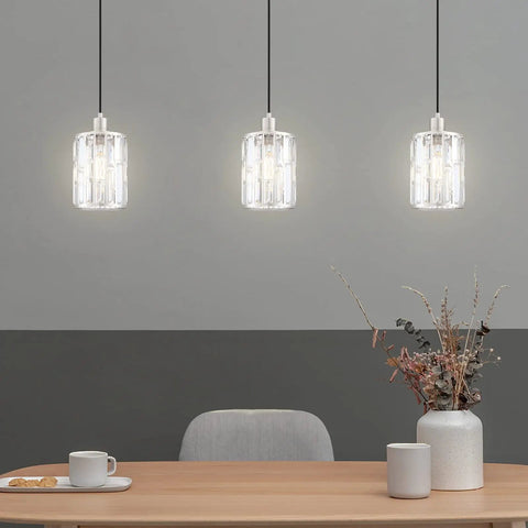 Three Pack Crystal Hanging Pendant Lights 5.5 Inch With Brushed Nickel Finish displayed over a dining table