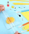 Hands using acrylic roller from 57 Piece Polymer Clay Tools Set With Acrylic Roller, Sheets, Scrapers, 12 Modeling Tools And 40 Stainless Steel Round Cutters For Your DIY Clay Crafting And Ceramics