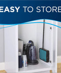 Super Lightweight Cordless Floor Sweeper With Dual Bottom Dump Bins For Snap Up Messes And Dust Clumps On Hardwood Tile And Area Rugs Compact Push Broom Cleaner In Teal stored in a white cabinet with other cleaning supplies.