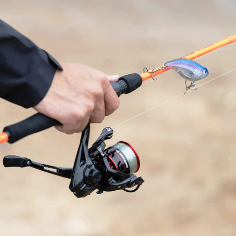 Close-up of angler casting with Royale Legend Spinning Reel With Dual Gear Ratios Five Point Two To One And Six Point Two To One Carbon Drag