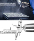 Compact Pneumatic Spray Gun With Tight 0.5mm Nozzle And 125ml Gravity Cup for precise spray application on various surfaces.