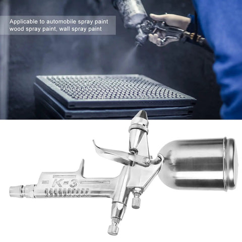 Compact Pneumatic Spray Gun With Tight 0.5mm Nozzle And 125ml Gravity Cup for precise spray application on various surfaces.