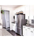 Modern kitchen with 25 Pack 3 Inch Black Cabinet Pulls Stainless Steel Drawer Handles visible on white cupboards around a fridge.