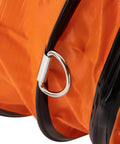 Close-up of Heavy-Duty Portable Air Blower With Hose For Fast Ventilation And Extraction's duct clamp and orange material