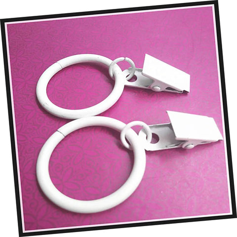 Two white metal curtain rings with clips from the Metal Curtain Rings With Clips Set 10 Pack Heavy Duty Design For Smooth Glide On Curtain Rods Fits Bathroom Bedroom Living Room Electroplated Modern Finish For Durable Hanging And Easy Shower Curtain Setup.