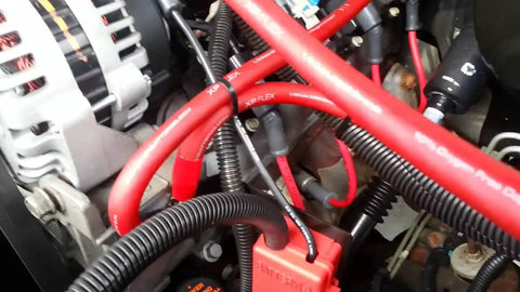 Heavy Duty Oxygen Free Copper Big Three Electrical Upgrade Kit Featuring Slick Snakeskin Braided Cables installed in engine compartment.