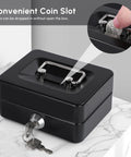 Compact Cash Box With Slot And Key Lock Portable Metal Money Safe on marble table, showing key lock and coin slot in use.