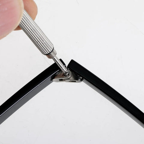 Premium Eyeglasses Repair Kit Including Two Pairs Of Replacement Arms And Legs With Non Slip Silicone Ear Tips Nose Pads Plus Full Hardware Set For No Sweat Fixes That Stay Hella Secure, using screwdriver on black temple arm.
